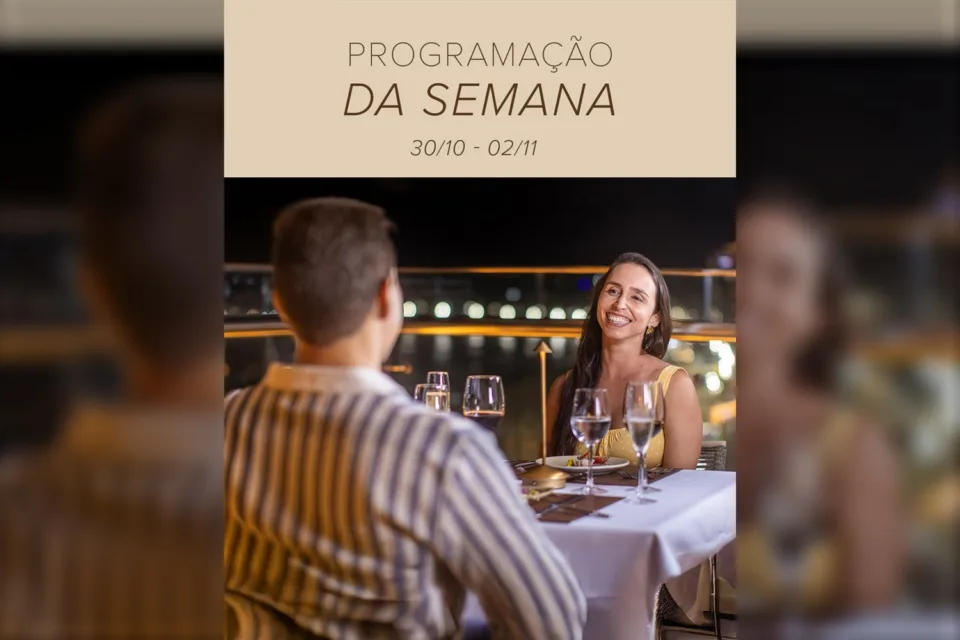 Casal jantando à noite em arte da programação da semana do Arena Hotels & Suites